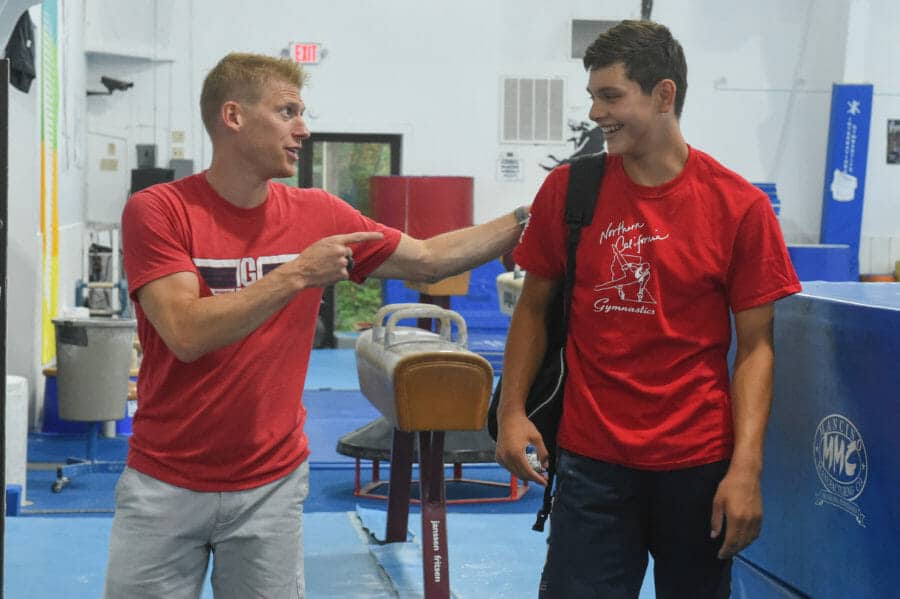 coach laughing with camper