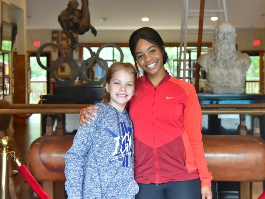 Celebrity guest Gabby Douglas with a camper