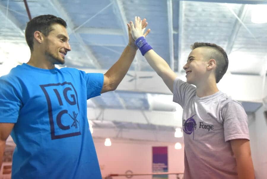 Celebrity guest high-fiving camper