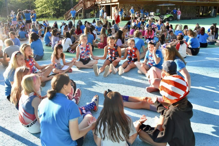 gymnasts in a group sitting circle