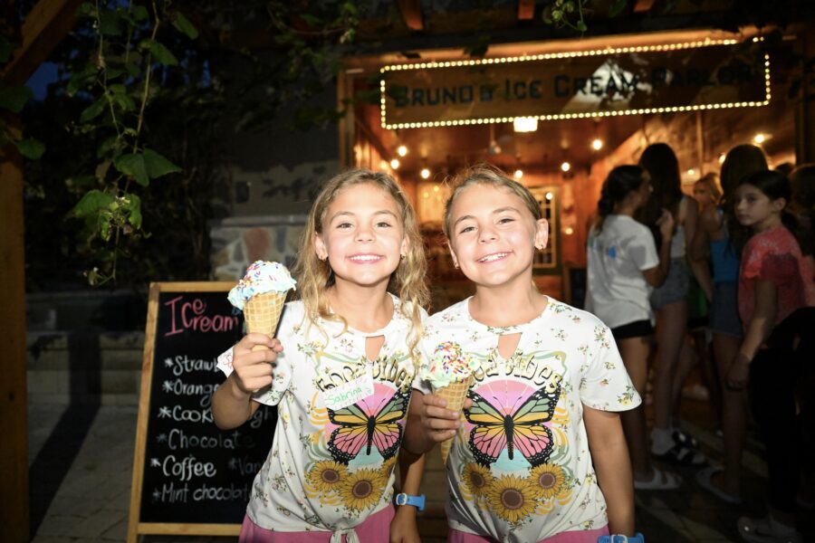 two girls enjoying ice cream cones